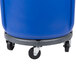 A blue Rubbermaid BRUTE recycling can with black wheels.