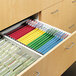 A drawer full of colorful files including Smead 64873 folders.