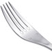 A close-up of a Chef & Sommelier stainless steel dinner fork with four tines.