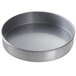 A Chicago Metallic round aluminized steel cake pan with a glazed finish.