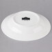 A white porcelain bowl with a black rim and label.