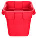 A red Rubbermaid square trash can with handles.