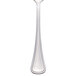 A Libbey serving spoon with a white handle and silver spoon.