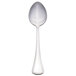 A silver Libbey serving spoon with a white handle.