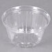 A Dart clear plastic dome lid on a clear plastic bowl.