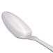 A close-up of a Libbey Kings stainless steel serving spoon with a silver handle.