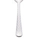 A Libbey stainless steel demitasse spoon with a textured handle.