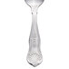 A close-up of a Libbey stainless steel demitasse spoon with a design.