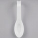 A white Fineline plastic spoon.