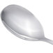An Arcoroc stainless steel spoon with a silver handle.