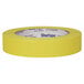 A roll of yellow Duck Masking Tape with the word "Shurp" on it.