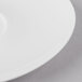 A white Schonwald Grace porcelain saucer with food on it.