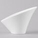 A Schonwald Calla bowl with a curved shape on a white surface.