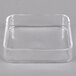 A clear square lid on a clear square glass container.