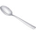 An Arcoroc stainless steel serving spoon with a silver handle.
