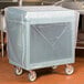 A slate blue Cambro tray and dish cart with a plastic covered box on wheels.