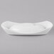 A Schonwald Grace white porcelain dish with a curved edge.