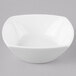A Schonwald white square bowl with a curved edge.
