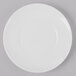 A Schonwald Grace white porcelain plate with a circular design on a gray surface.