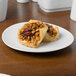 Two Schonwald Grace porcelain plates with small pastries filled with nuts and pecans.