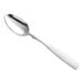 A Choice Delmont stainless steel spoon with a silver handle.