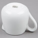 An American Metalcraft white porcelain creamer with a handle.