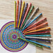 A group of Prismacolor Premier colored pencils arranged in a circular pattern.