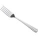 A close-up of a Choice Dominion stainless steel dinner fork with a silver handle.