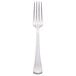 A Libbey stainless steel European dinner fork with a white handle.