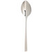 An Arcoroc stainless steel dinner spoon with a long handle.