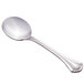 A close-up of a World Tableware Resplendence stainless steel bouillon spoon.