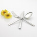 A spoon and fork with flowers on the handle.