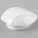 A Schonwald white porcelain teapot lid with a white knob on a gray surface.