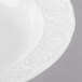 A close up of a white Schonwald Marquis soup bowl with a design on the rim.