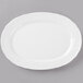 A Schonwald white porcelain oval platter with a white rim and a decorative border.