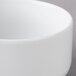 A close-up of a Schonwald Avanti Gusto white porcelain bouillon cup.