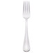 A silver Libbey Reflections utility/dessert fork with a white handle.