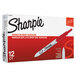 A white box with red and white text containing 12 red Sharpie Ultra-Fine Point Retractable Permanent Markers.