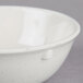 A white Thunder Group San Marino nappie bowl with speckled surface.