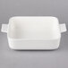 A white square Villeroy & Boch ceramic dish with handles.