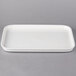 A white rectangular Villeroy & Boch porcelain tray with a handle.