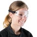 A woman wearing Cordova Anti Fog Dust / Splash Safety Goggles.