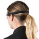 A woman wearing Cordova Anti Fog Dust / Splash Safety Goggles and a ponytail.