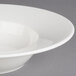 A close up of a white Villeroy & Boch Affinity porcelain bowl with a rim.