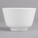 A Villeroy & Boch white porcelain bowl with a white rim on a gray surface.
