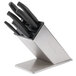 A Dexter-Russell knife block set with black handles on a stand.