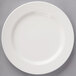 A Villeroy & Boch white porcelain plate with a curved edge.