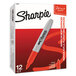 A white box with red text reading "Sharpie Super Red Fine Point Permanent Marker" with a red Sharpie marker tip visible.