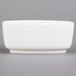 A white rectangular Villeroy & Boch porcelain sugar bowl with a lid on a gray surface.
