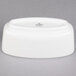 A white porcelain sugar bowl with a lid.